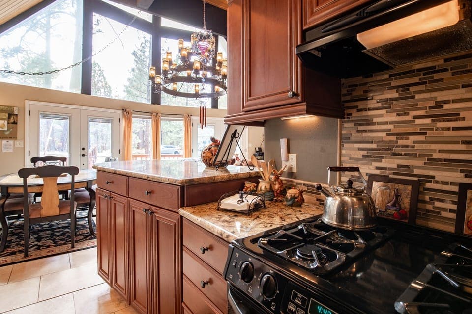 Fully equipped cabin kitchen with ample cabinetry, stove, fridge, microwave, and coffee maker—perfect for cooking meals, morning coffee, and feeling right at home on your stay.