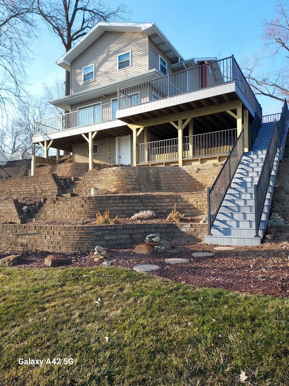 View of house from lakefront. New deck and steps.