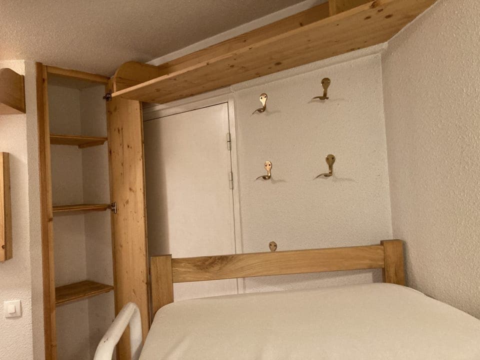 Storage for bunk bedroom and helmet hooks.  Suitcases fit underneath the bunks.