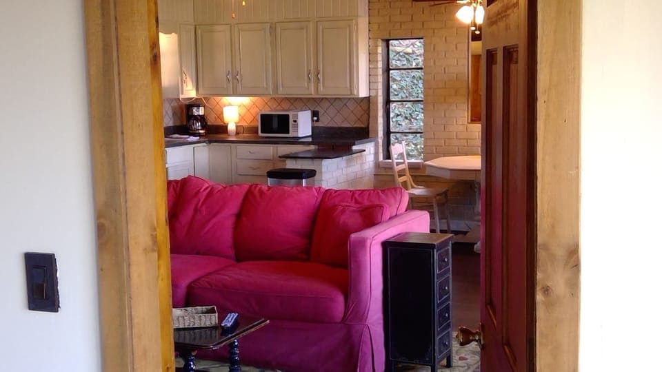 bedroom view of living room and kitchen