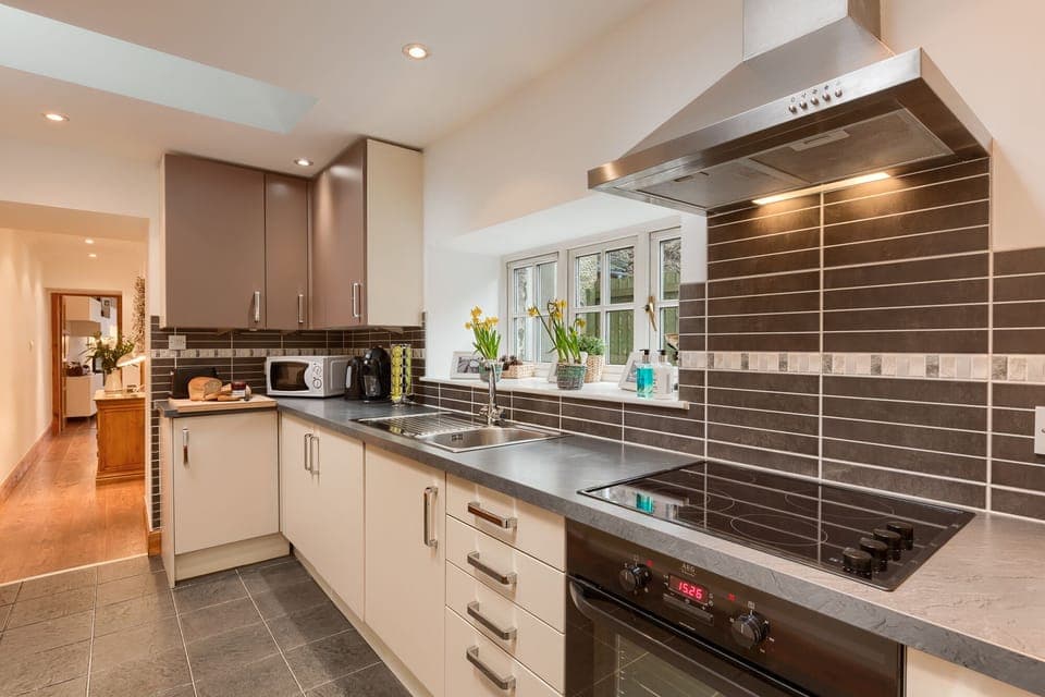 Galley kitchen with all mod cons, including coffee machine