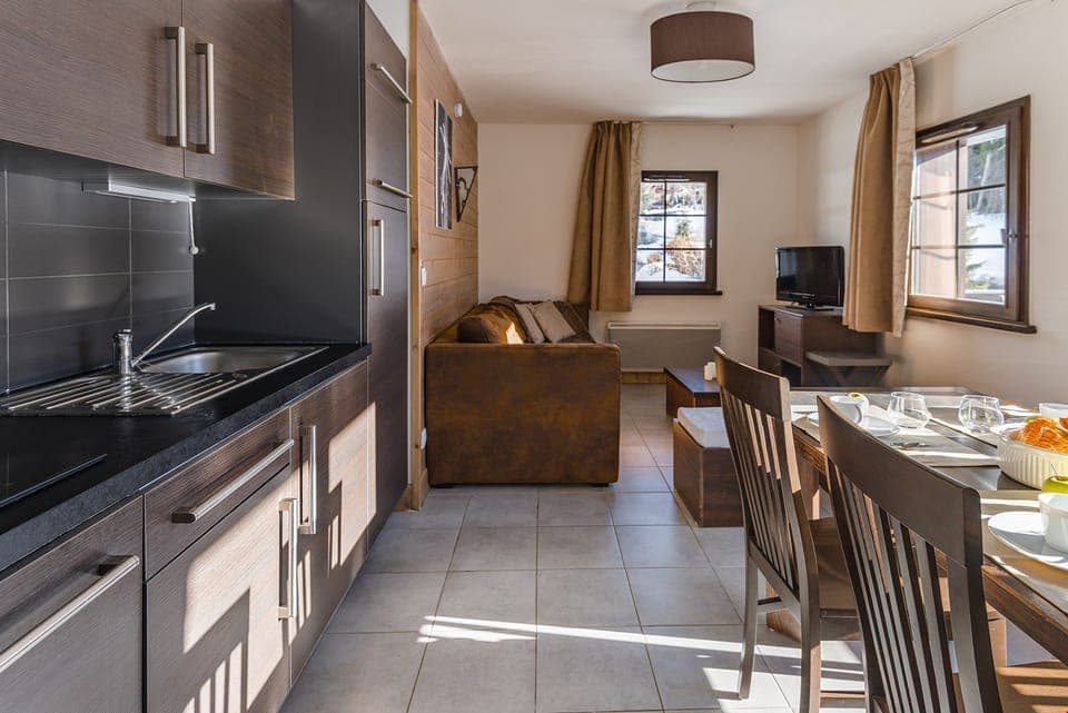 Prepare meals in the kitchenette and enjoy them at the dining table.