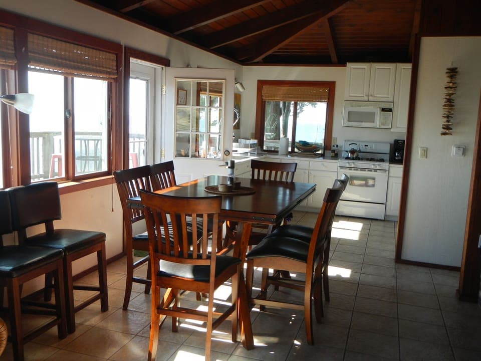 Counter-height dining table, waterfall chairs for comfort and optimal viewing.