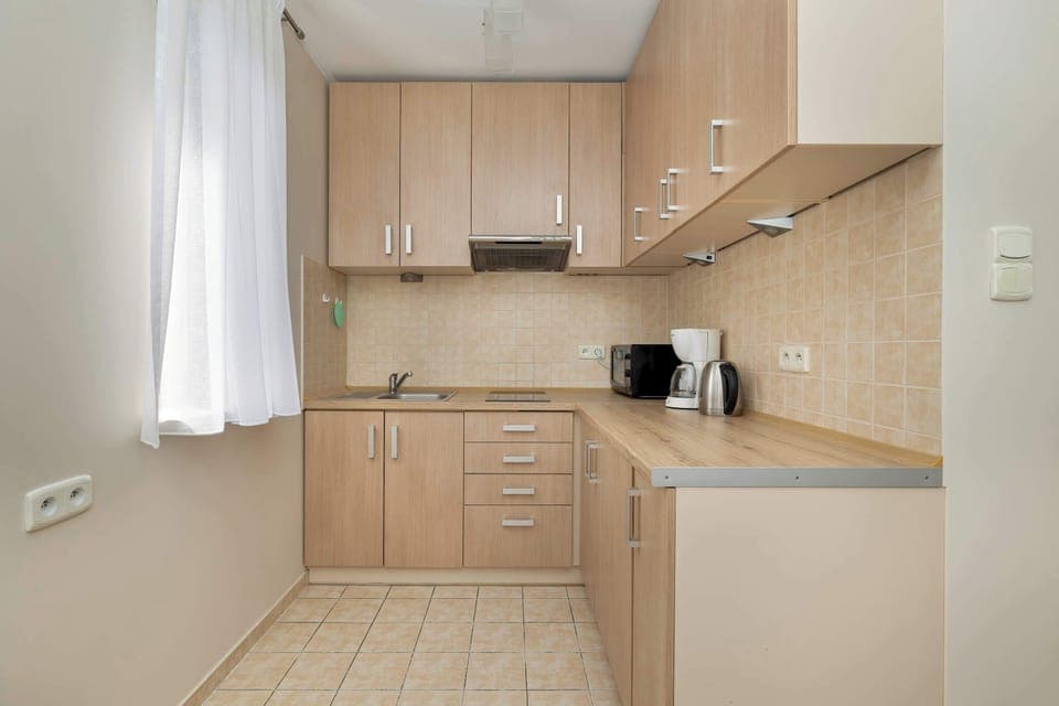 Bright, functional kitchenette with high-quality appliances.