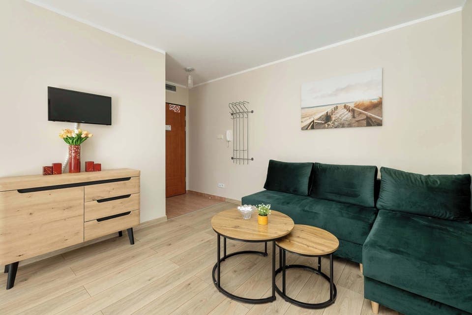 Spacious living room with a large corner sofa and soft lighting – perfect for relaxing evenings.

