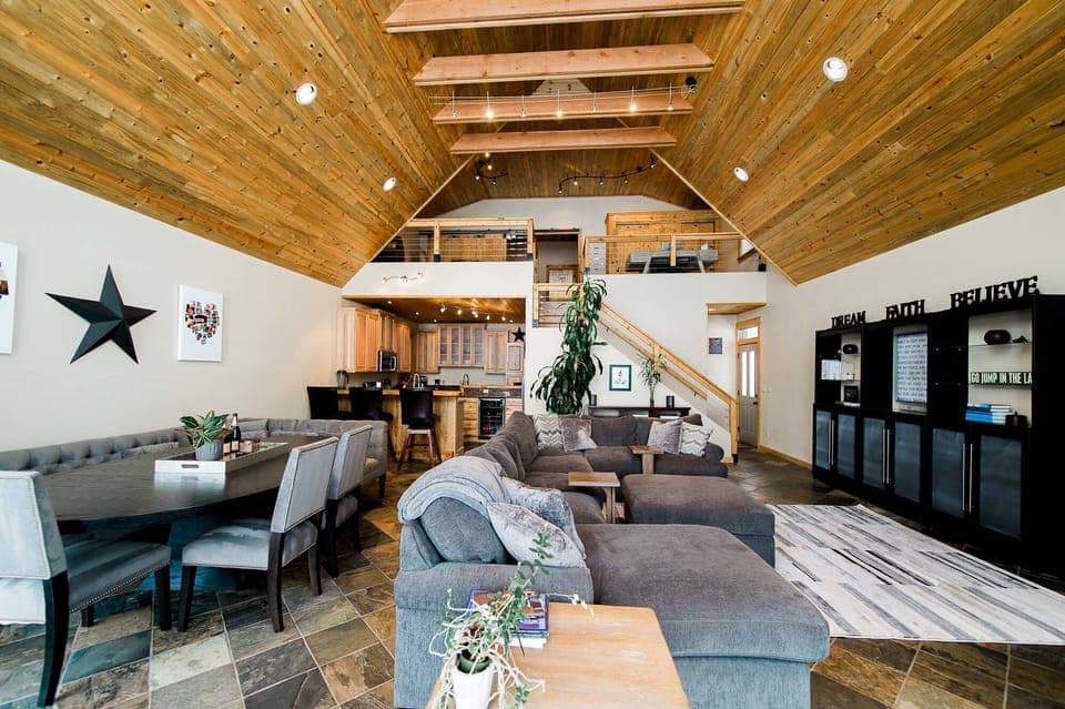 Main floor living, dining and kitchen area facing the lake