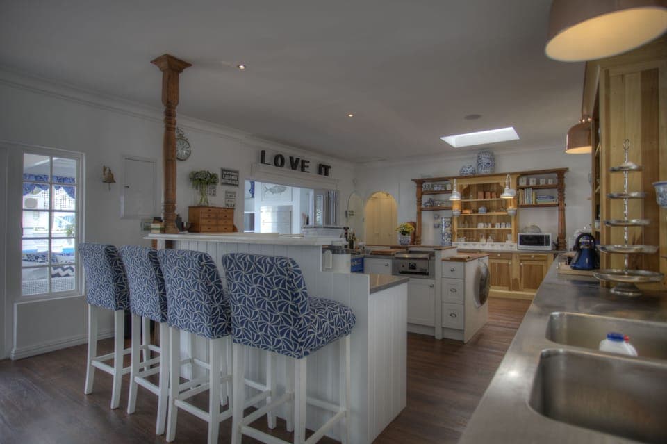 Super large gourmet and entertainers kitchen, opening to patio,  pool and garden