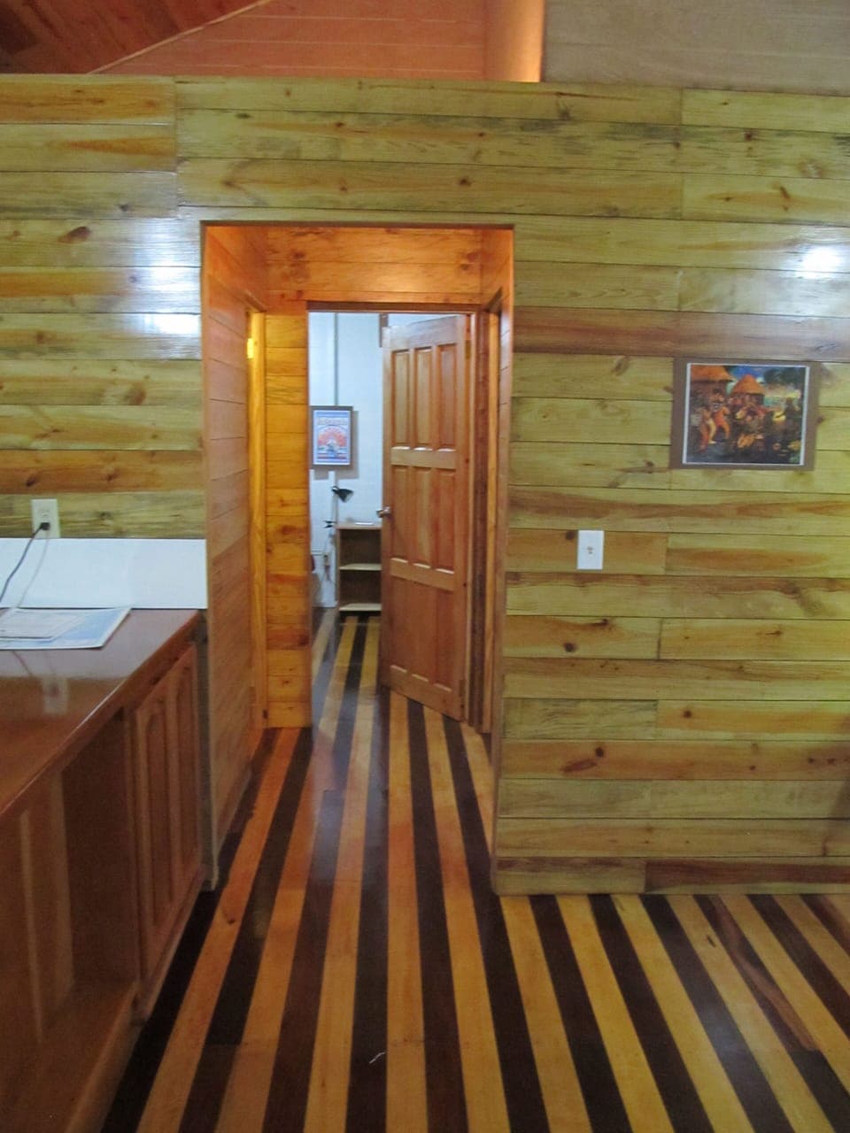 Looking down hallway to bedrooms, bath.