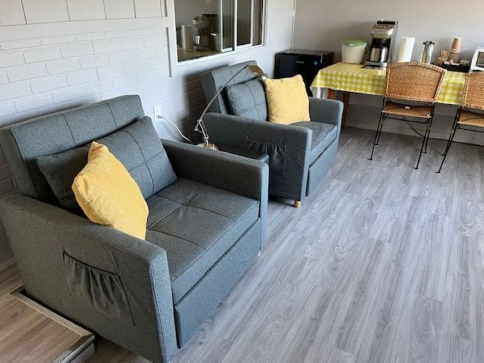 Patio with Twin sleeper chairs and food prep area.