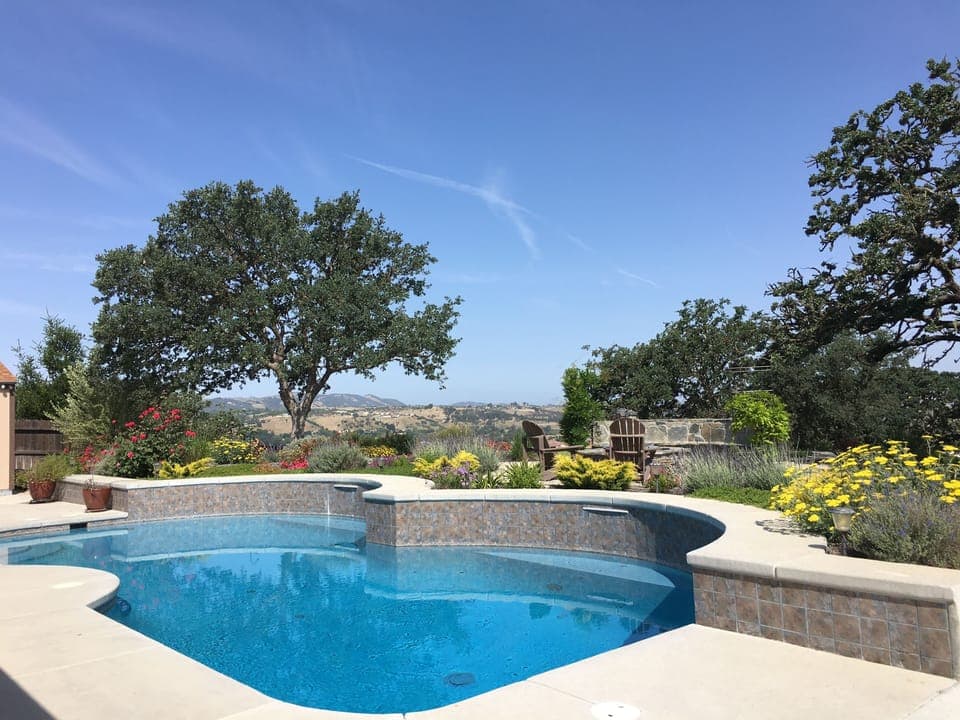 Beautiful swimming pool surrounded by gorgeous landscaping!