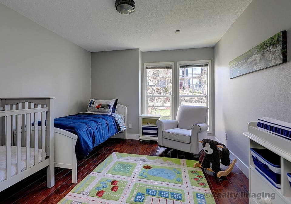 Bedroom #3 with a twin bed and a crib