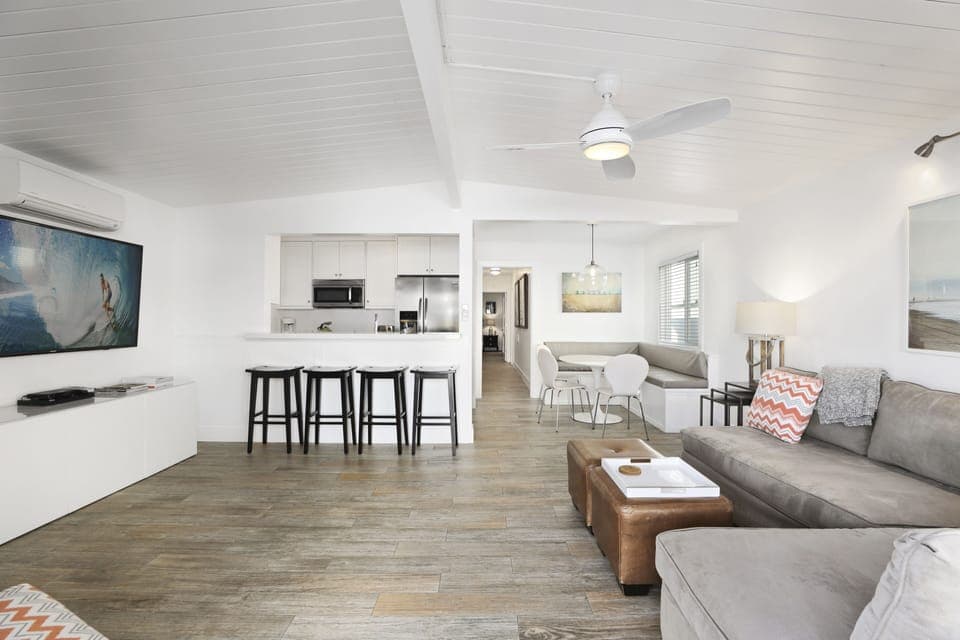 Open living room downstair, dining and kitchen.  Comfy couch, 65" TV, DVD Player