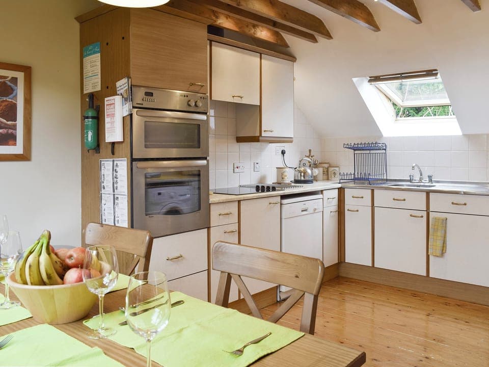 Well-equipped kitchen with dining area | Osprey Cottage - Hatton Cottages, Dunkeld, near Pitlochry