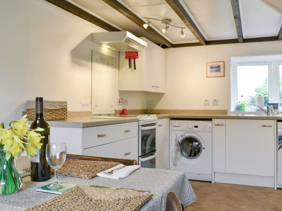 Characterful wooden beamed ceiling within kitchen | Blairhosh Cottage, Balloch, Loch Lomond