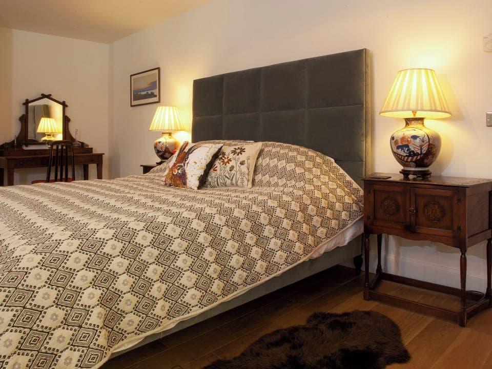 Super kingsize bed within the master bedroom | Strathspey Lodge, Duthil, Carrbridge, near Aviemore