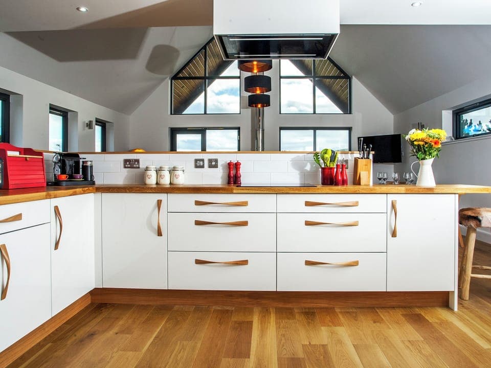 Modern kitchen integral to the open-plan design | Strathspey Lodge, Duthil, Carrbridge, near Aviemore