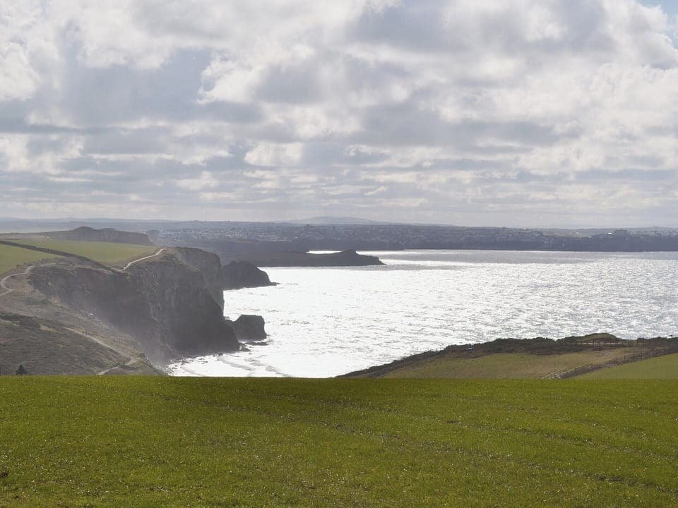 Nearby Watergate Bay is a mecca for seasiders and surfers alike | Coachmans Cottage, White Cross, near Newquay