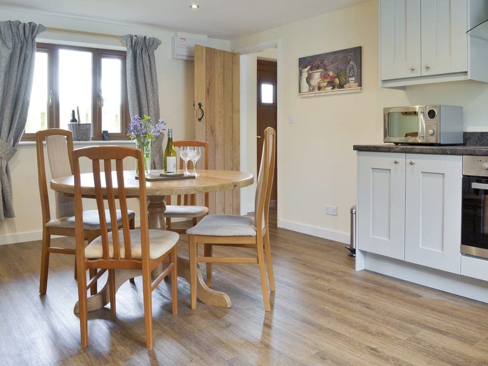 Convenient dining area within kitchen | The Lodge, Wedmore, near Cheddar