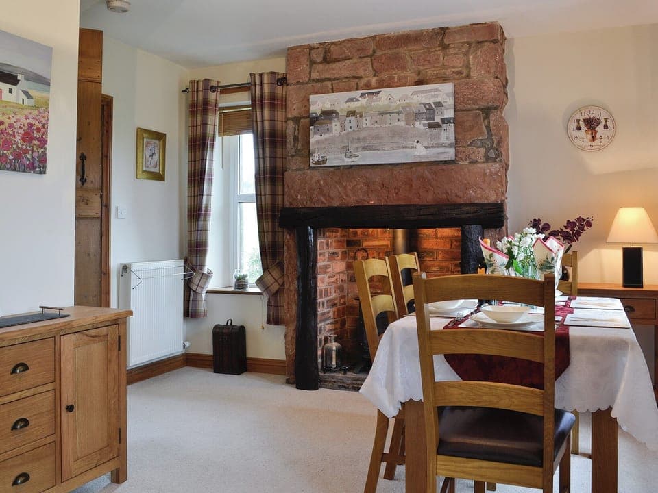 Dining room with wood burner | Rose Cottage - Springfield Farm Cottages, Bigrigg, near Egremont