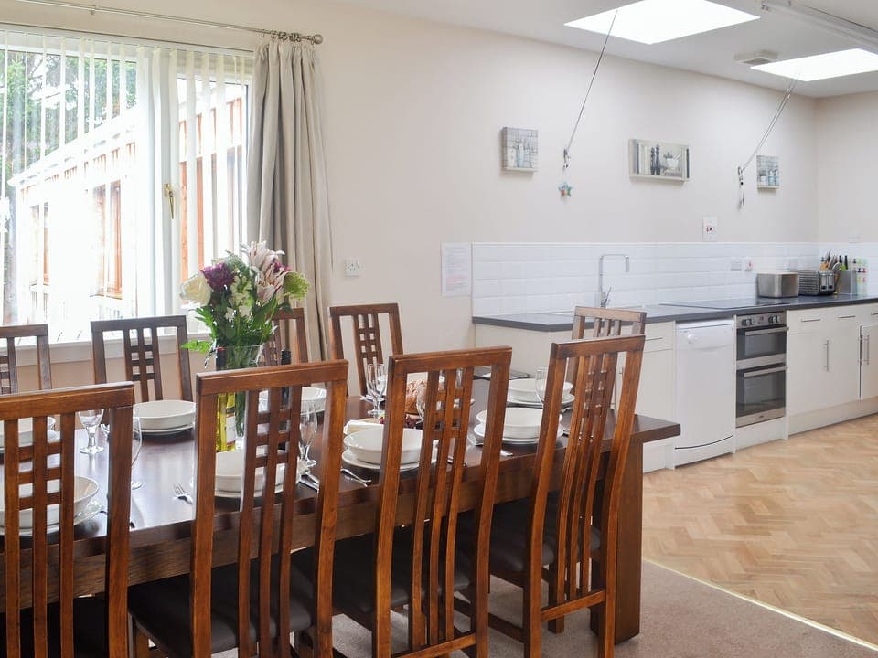 Dining area with wonderful vire of the garden | Loramore, Aviemore
