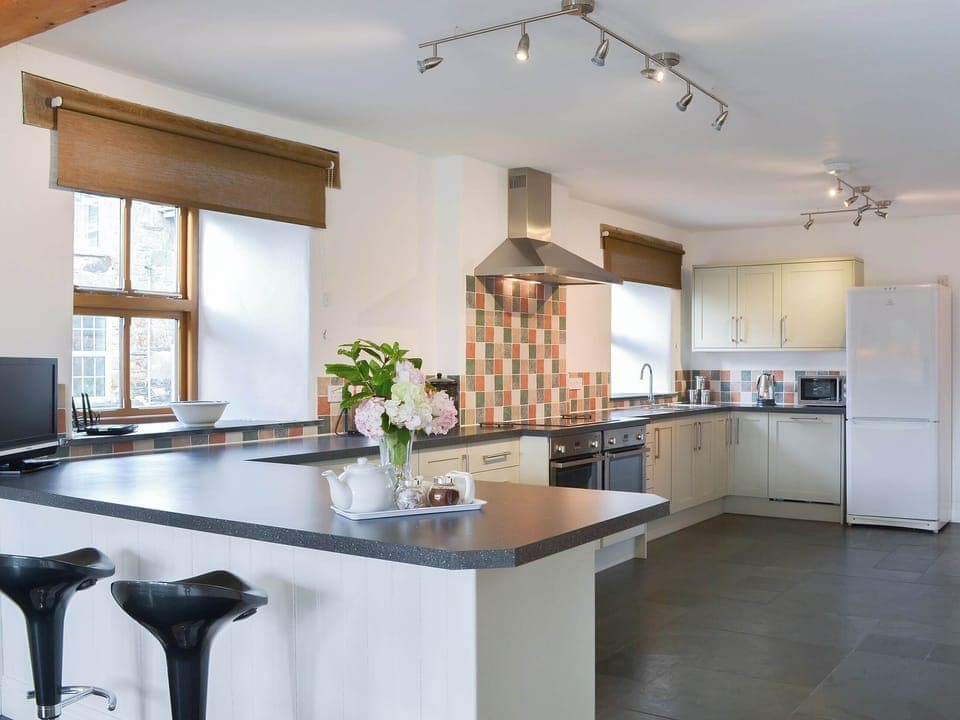 Large fitted kitchen with breakfast bar | Polmear Barn, Tregoodwell, Camelford