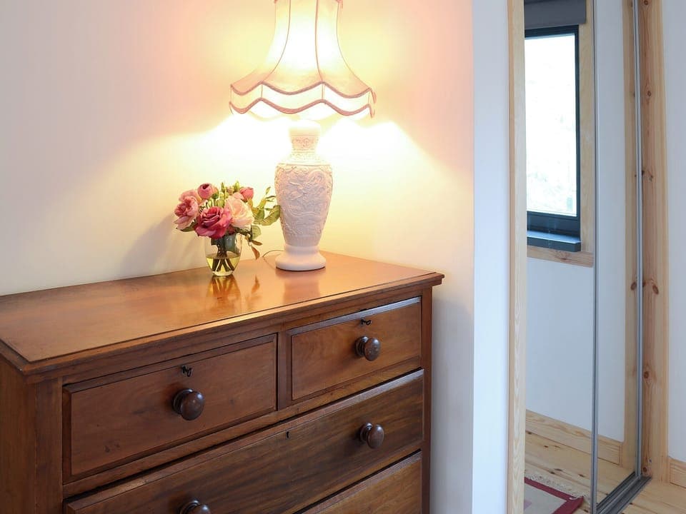The double bedroom is finished with homely touches | Fionn Croft Lodge, Melvaig, near Gairloch
