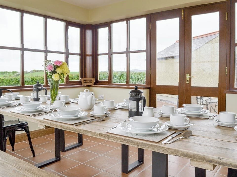 Light and airy dining room | Llofft Storws - Bronallt Barns, Llanynghenedl, near Holyhead