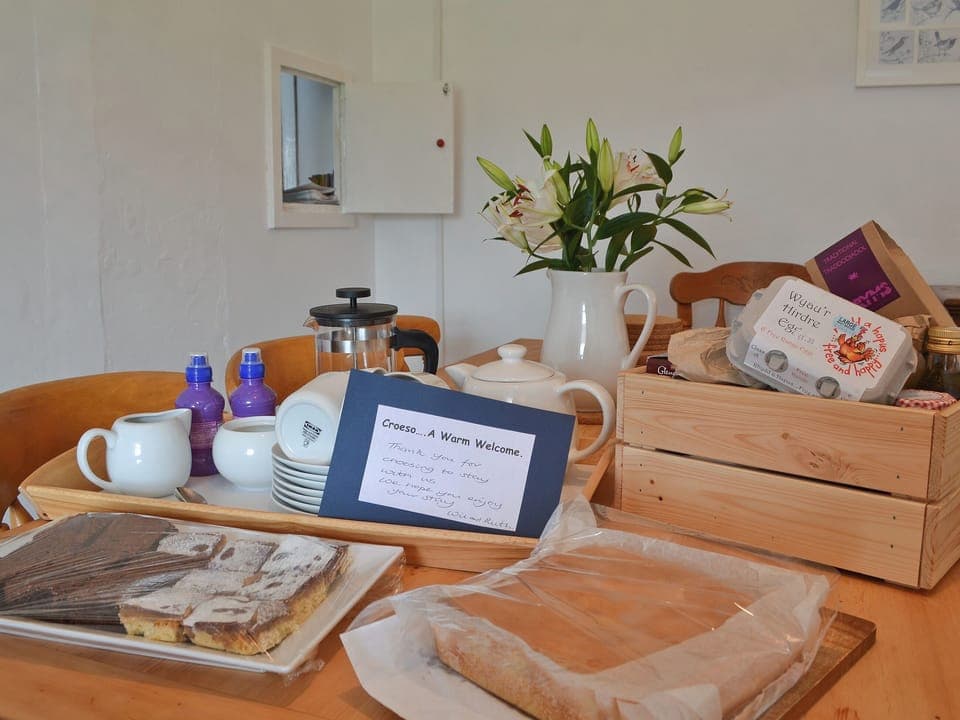 Dining room with welcome pack | Ty Hen, Llangwnnadl near Pwllheli