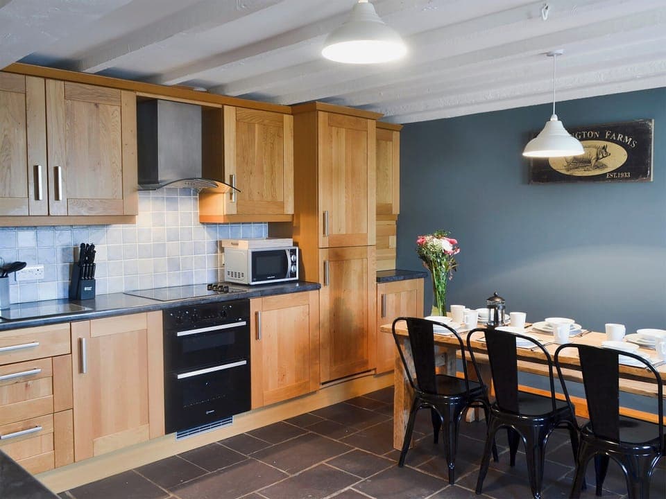 Kitchen and dining area | Yr Hen Stabal - Bronallt Barns, Llanynghenedl, near Holyhead