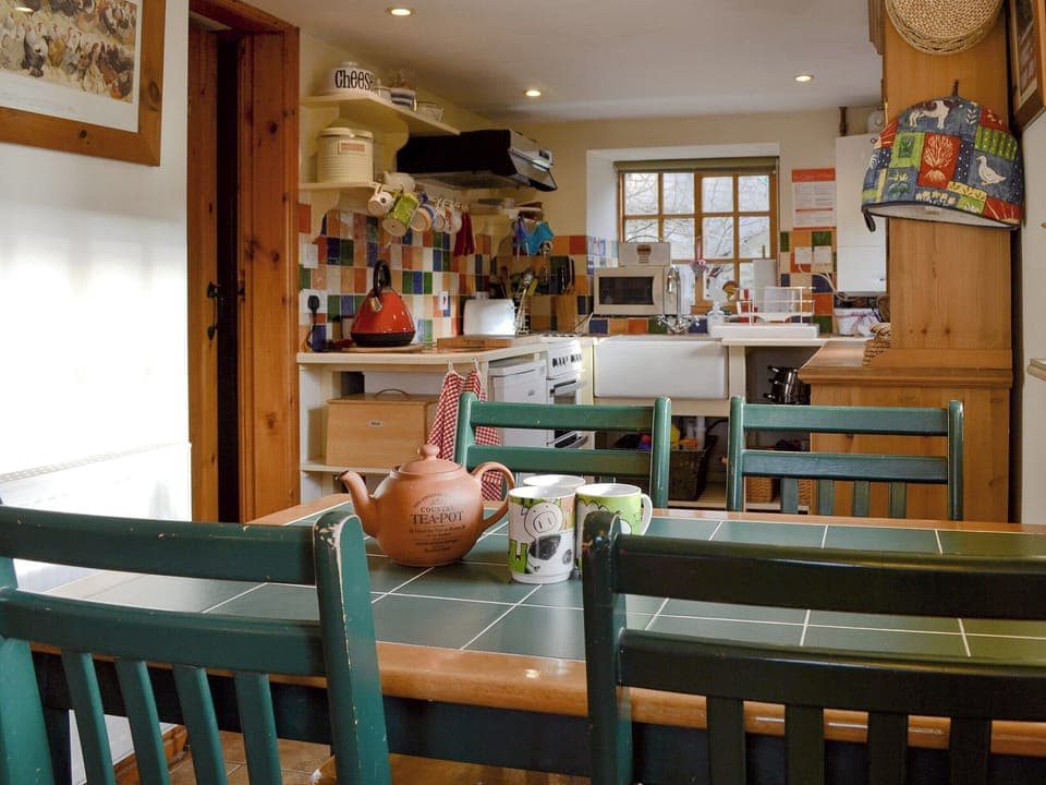 Dining area opening into kitchen | Cruck Cottage, Sinnington near Pickering