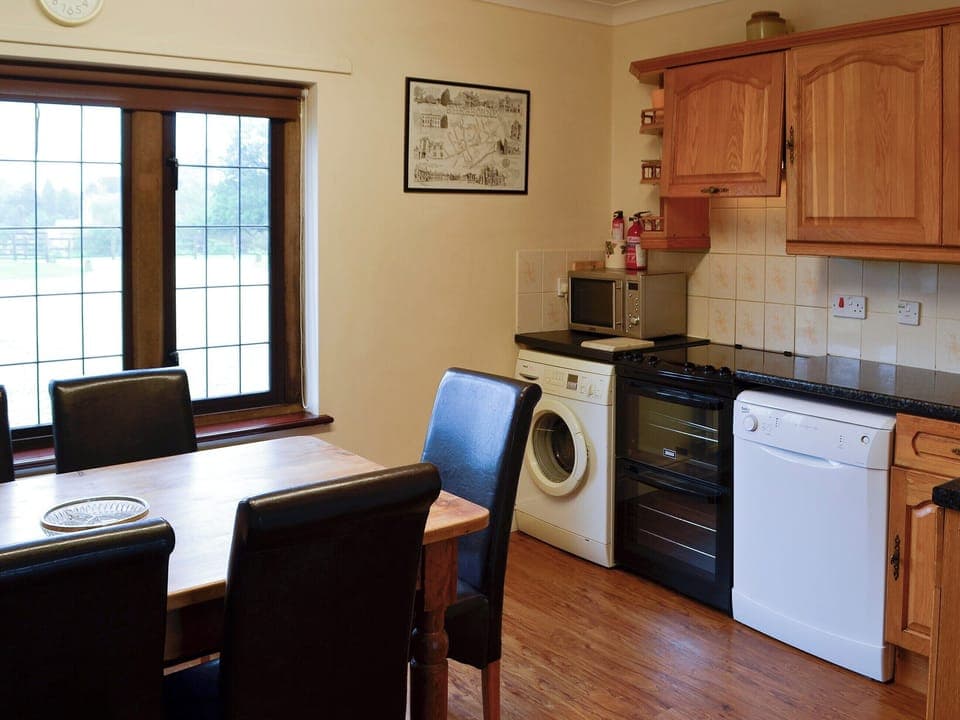Modest kitchen with breakfast area | Canon Court Farmhouse, Milborne Port, near Sherborne