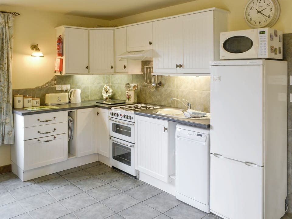 Well-equipped fitted kitchen | Riverside Cottage, Old Costessey