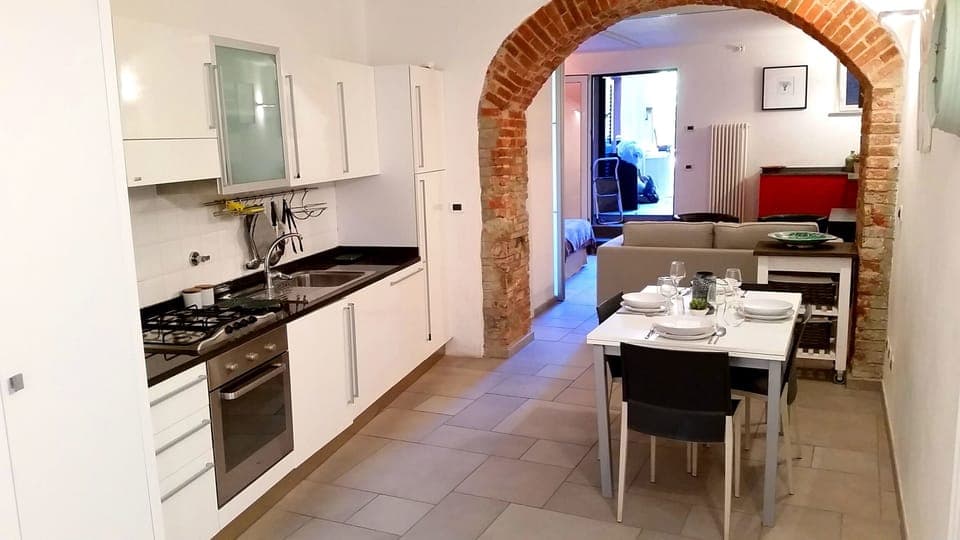 Kitchen/Dining Room; original archway into Living Room. 