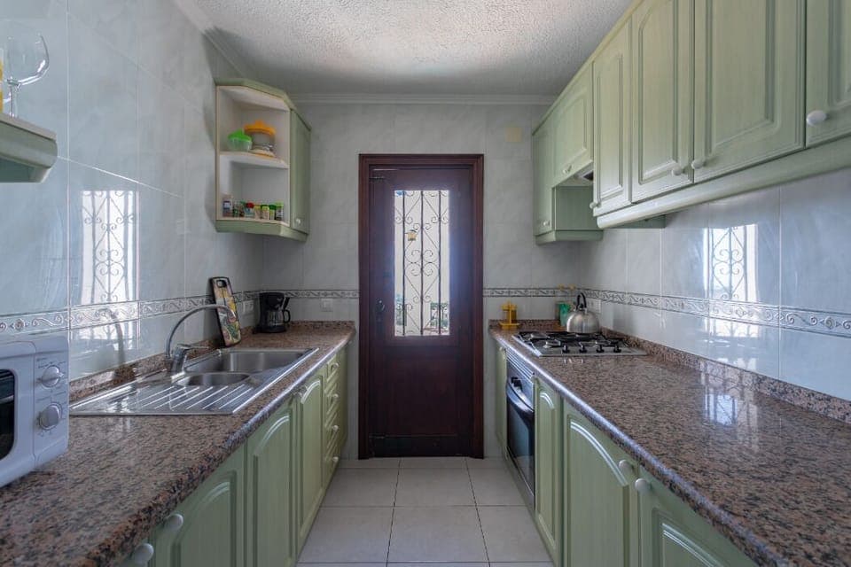 Kitchen top apartment leading off to private terrace