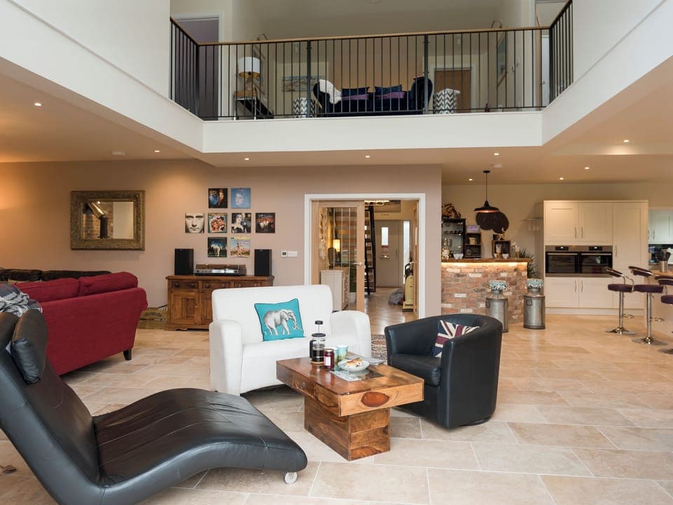 Open plan living space with high vaulted ceilings | The Haybarn - Bedborough Farm Cottages, Wimborne