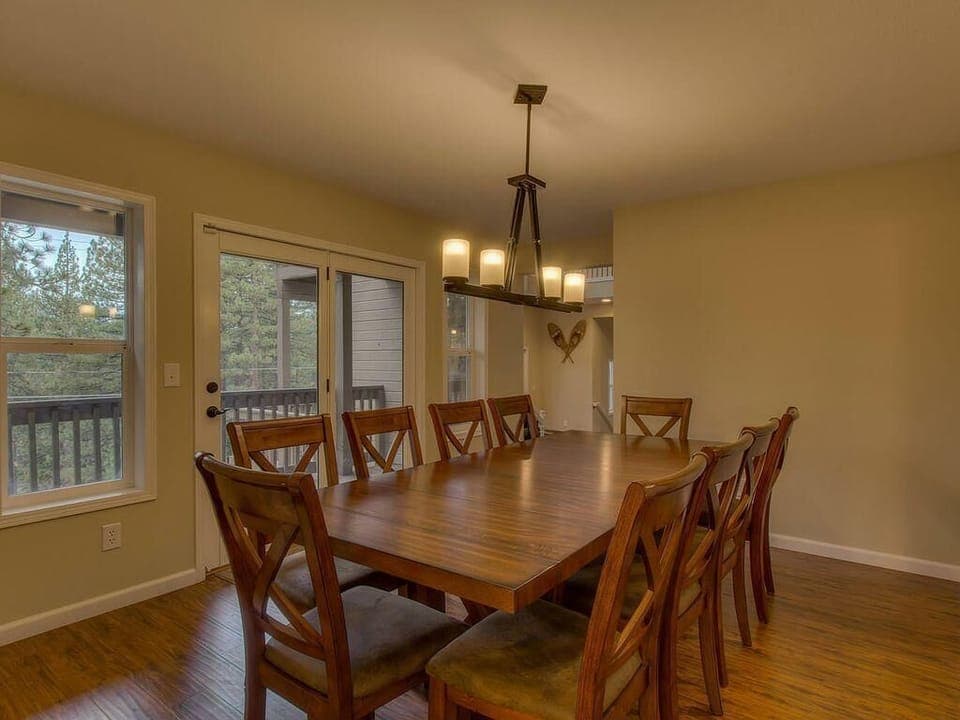 Spacious dining room with natural light and deck access