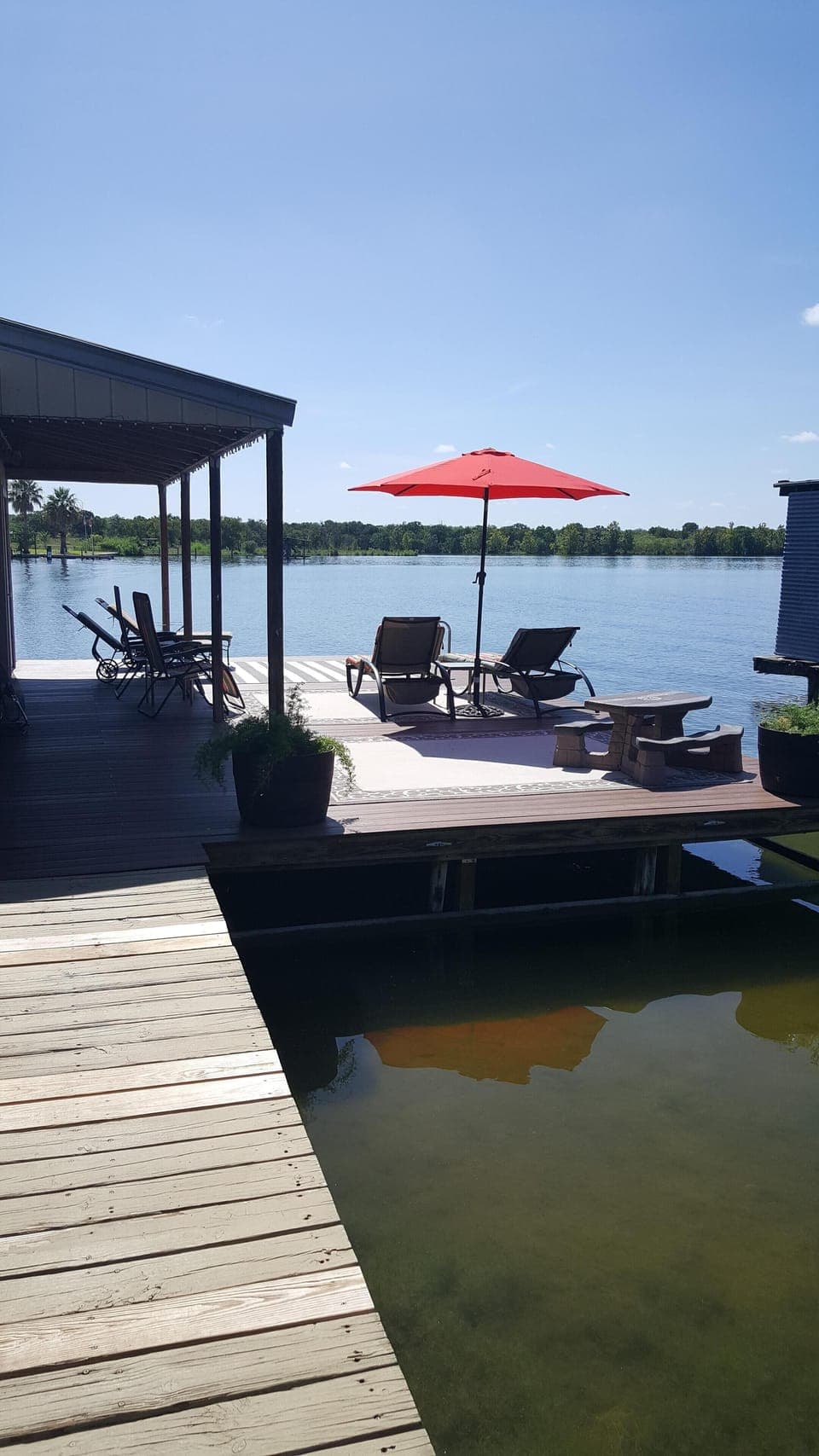 Large dock for lounging, swimming, and fishing.