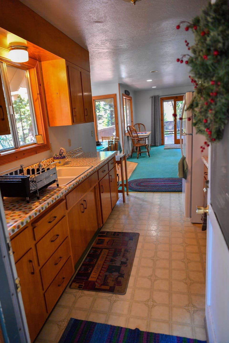 Galley kitchen looking into living room.