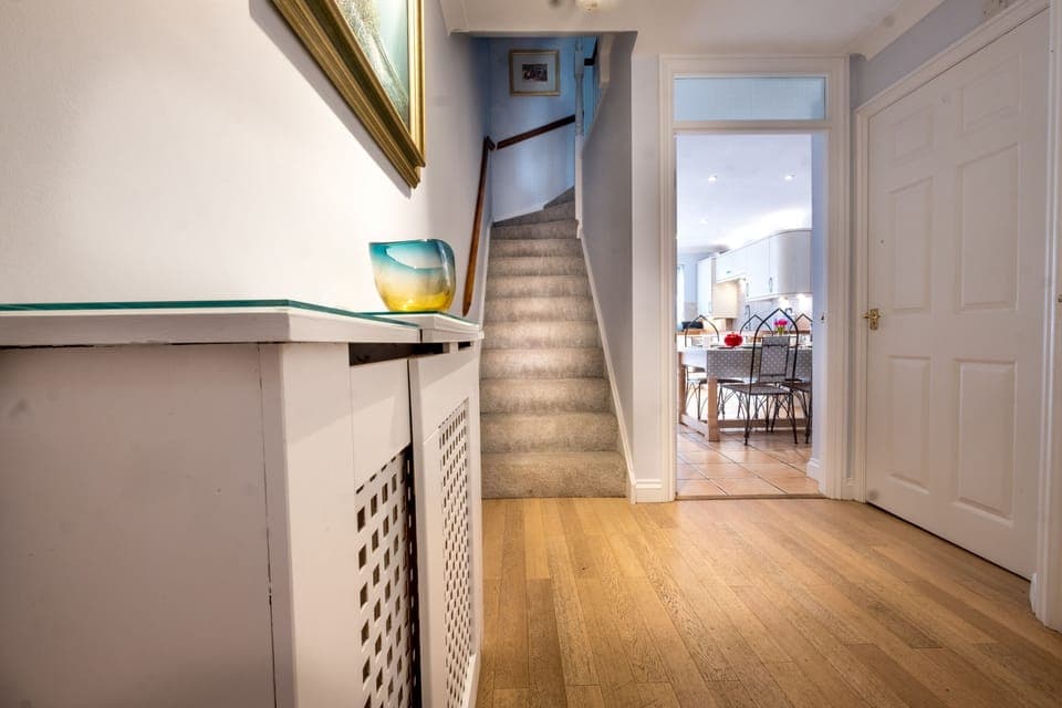 The welcoming hallway leading to the kitchen and family room.