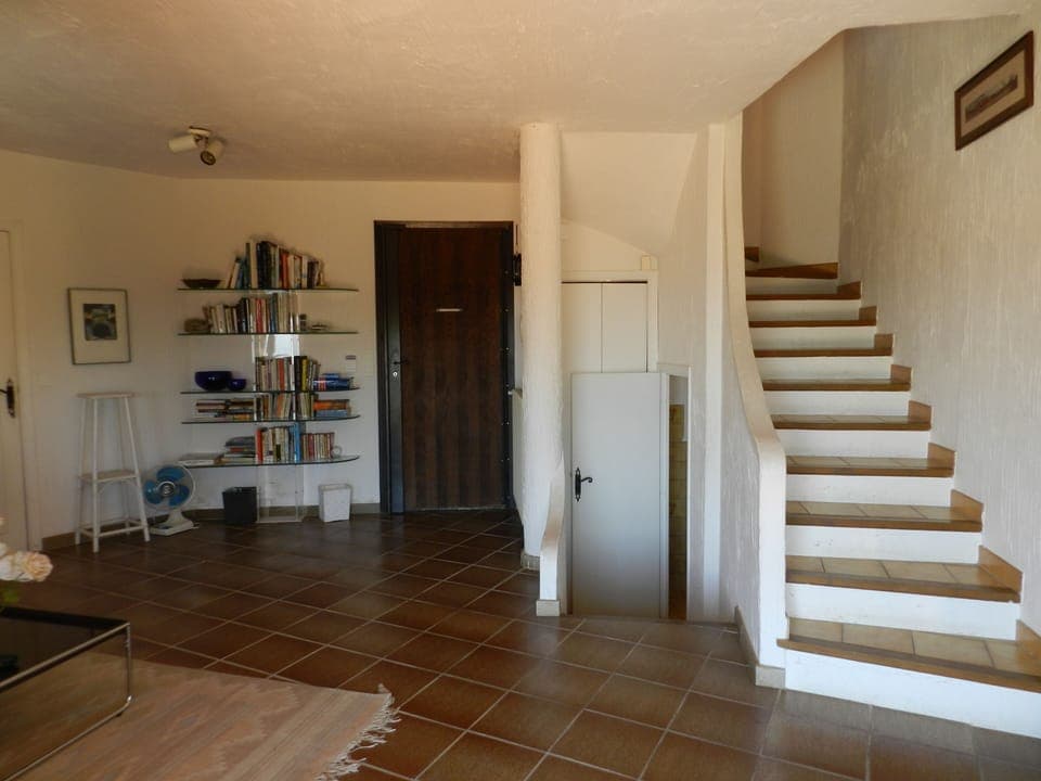 Entrance door and stairs to first floor