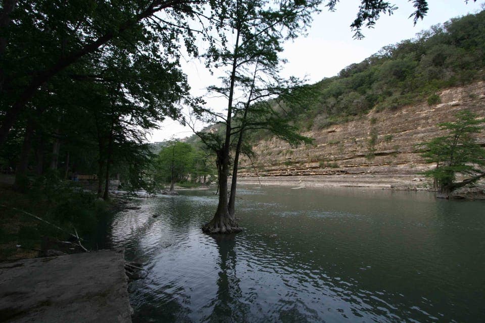 From the river front lot, there is a view of the cliff directly across the river