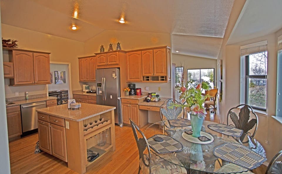 FULLY FURNISHED GOURMET KITCHEN WITH ADDITIONAL  DINING FOR FOUR TO SIX