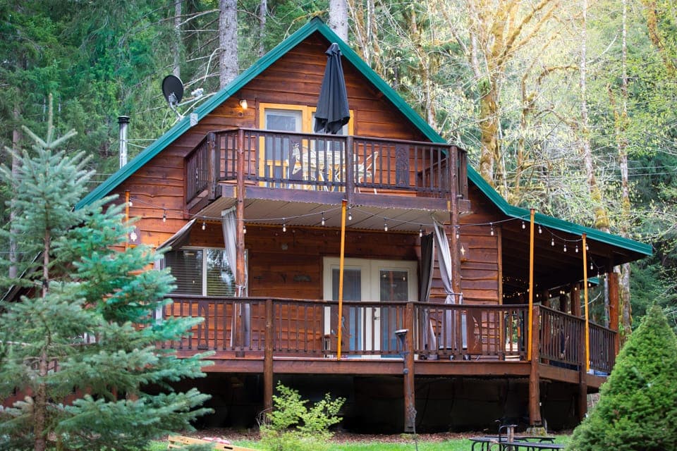 Around back! Upper and lower decks for relaxing and a good size yard for games!
