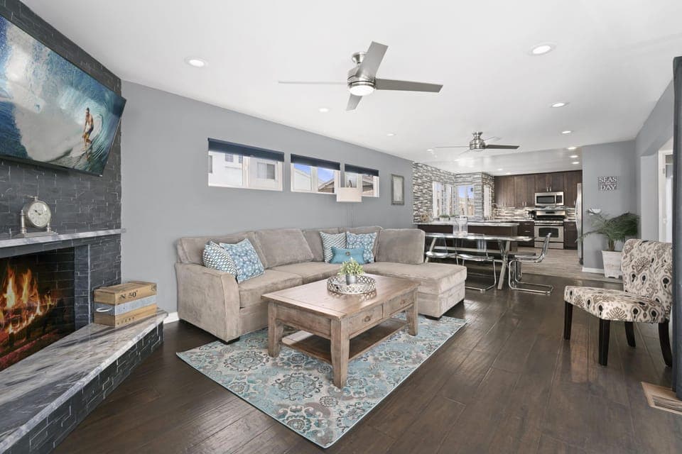 Modern and cheery open floor plan welcomes guests to the upper, ocean view level of this two-story main house. Ceiling fans throughout.
                