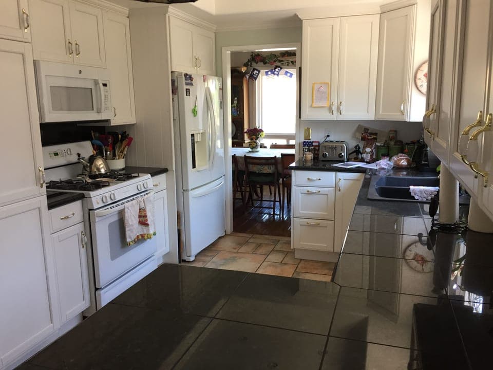 Kitchen with granite counters, extra large oven, fully-equipped, and dishwasher.