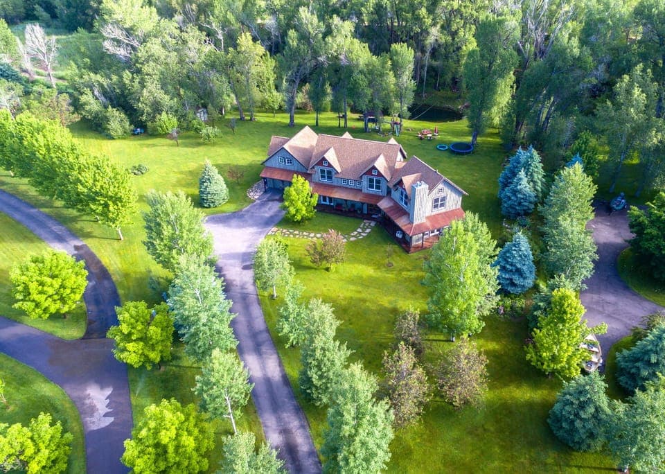 Aerial View of Spring Creek Estate.  2 acres and trout pond and huge flat yard