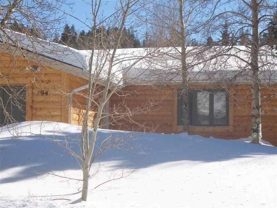 front of the house, lots of trees and plenty of  parking