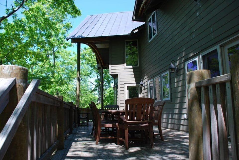 spacious deck, dining table seats 8, lounge chairs and grille