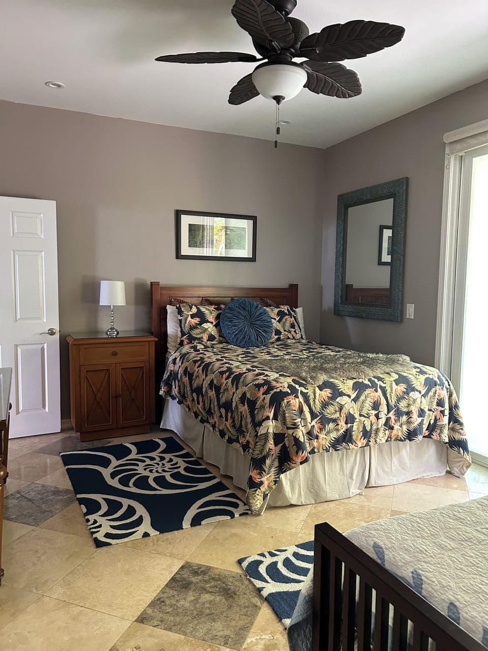 Third bedroom has a queen and two twins + ensuite bath. Slider opens to outside.