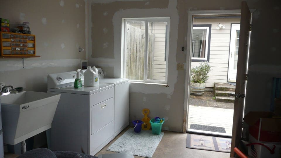 2 SETS of washer & dryers in detached garage; SurfSounds laundry area shown.